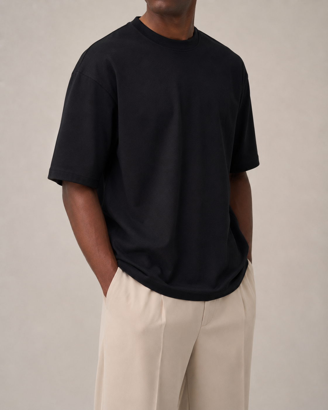 The Comfort Fit in Black — oversized Suvin cotton t-shirt on model, front view.