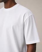 The Comfort Fit in White — Suvin cotton sleeve detail on model.