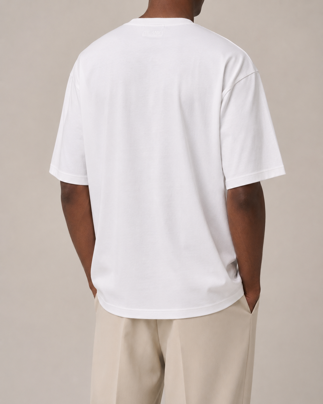 The Comfort Fit in White — oversized Suvin cotton t-shirt on model, back view.