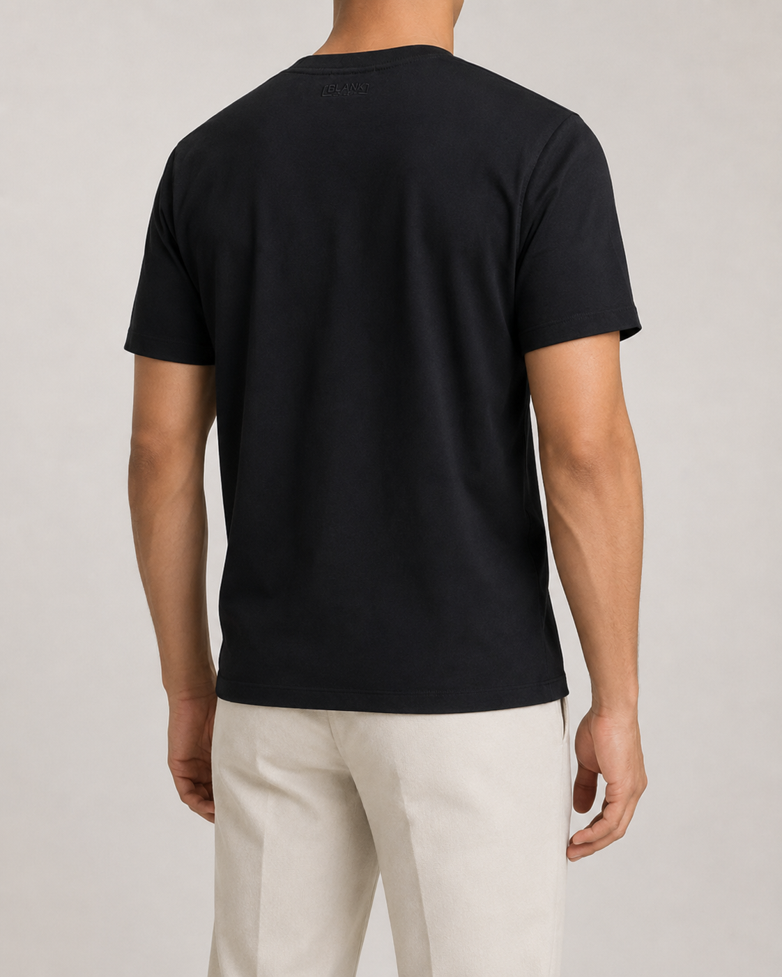 The Standard Fit in Black — classic-fit Suvin cotton t-shirt on model, back view.