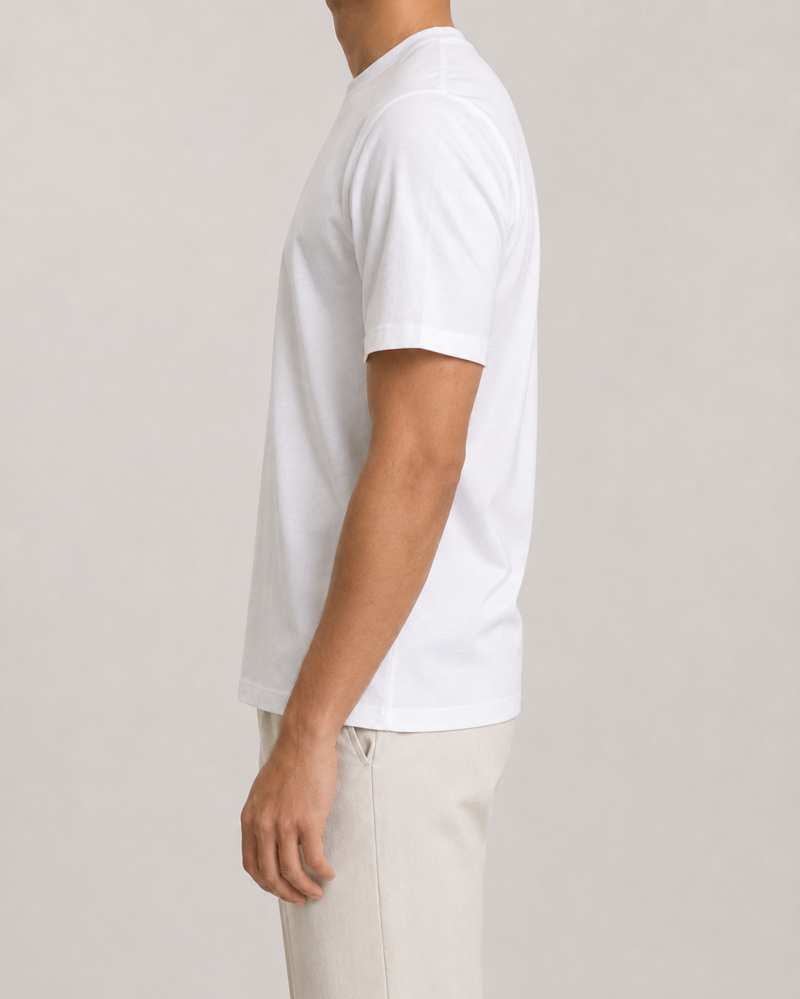 The Standard Fit in White — classic-fit Suvin cotton t-shirt on model, side view.