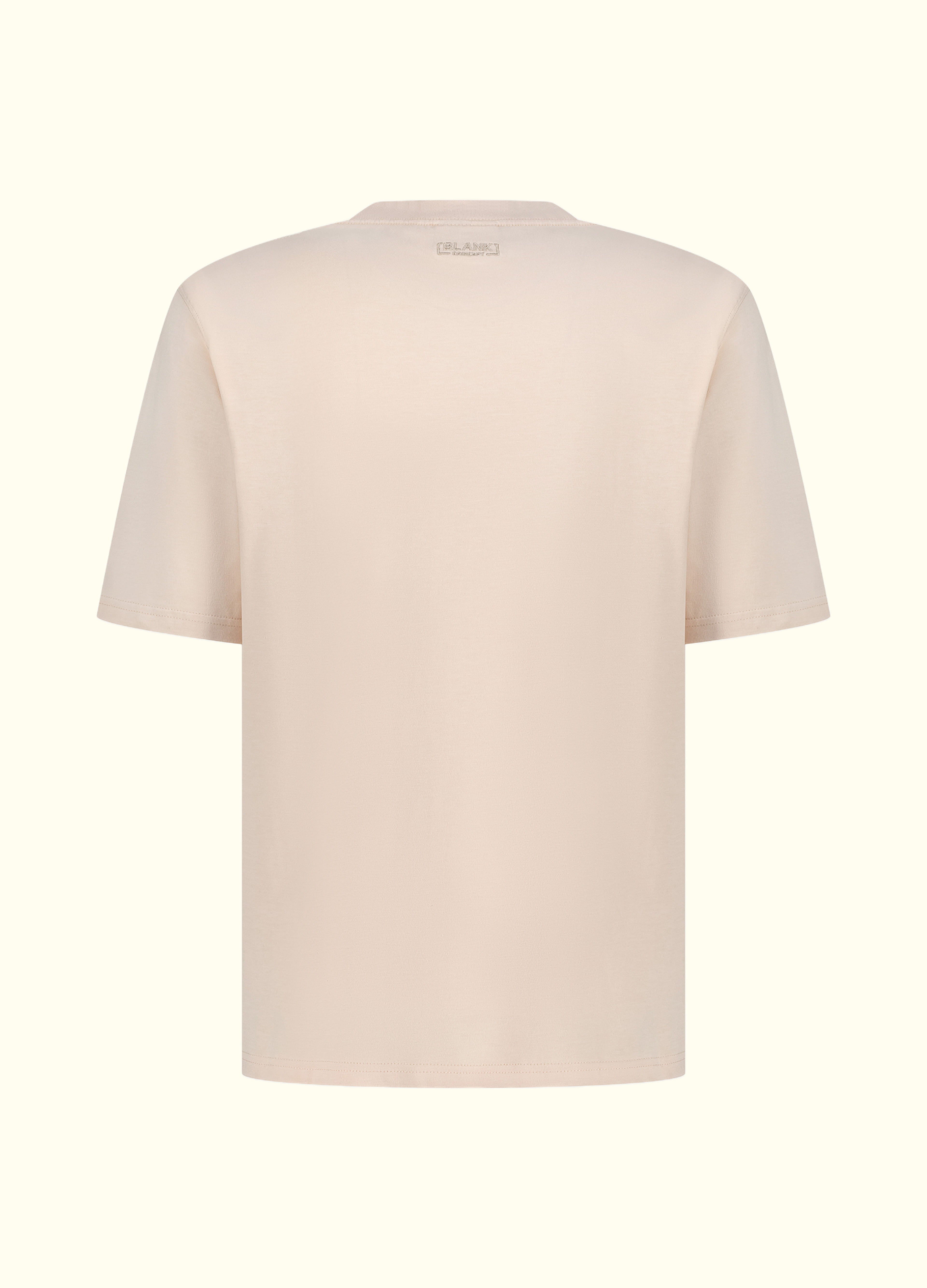 The Comfort Fit in Mother of Pearl — oversized Suvin cotton t-shirt, back view.