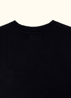 The Standard Fit in Black — close-up of the Suvin cotton fabric.