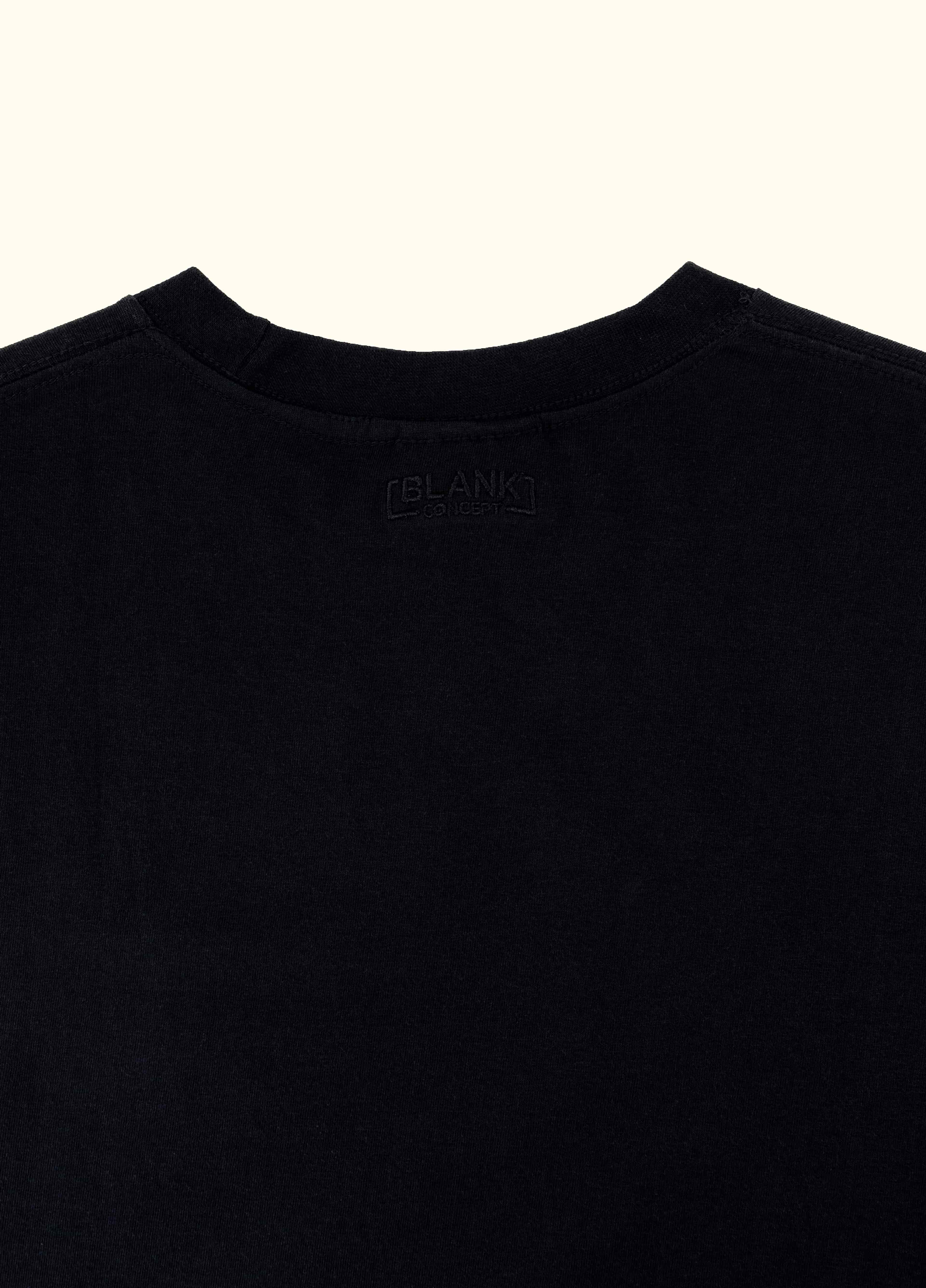 The Standard Fit in Black — close-up of the Suvin cotton fabric.